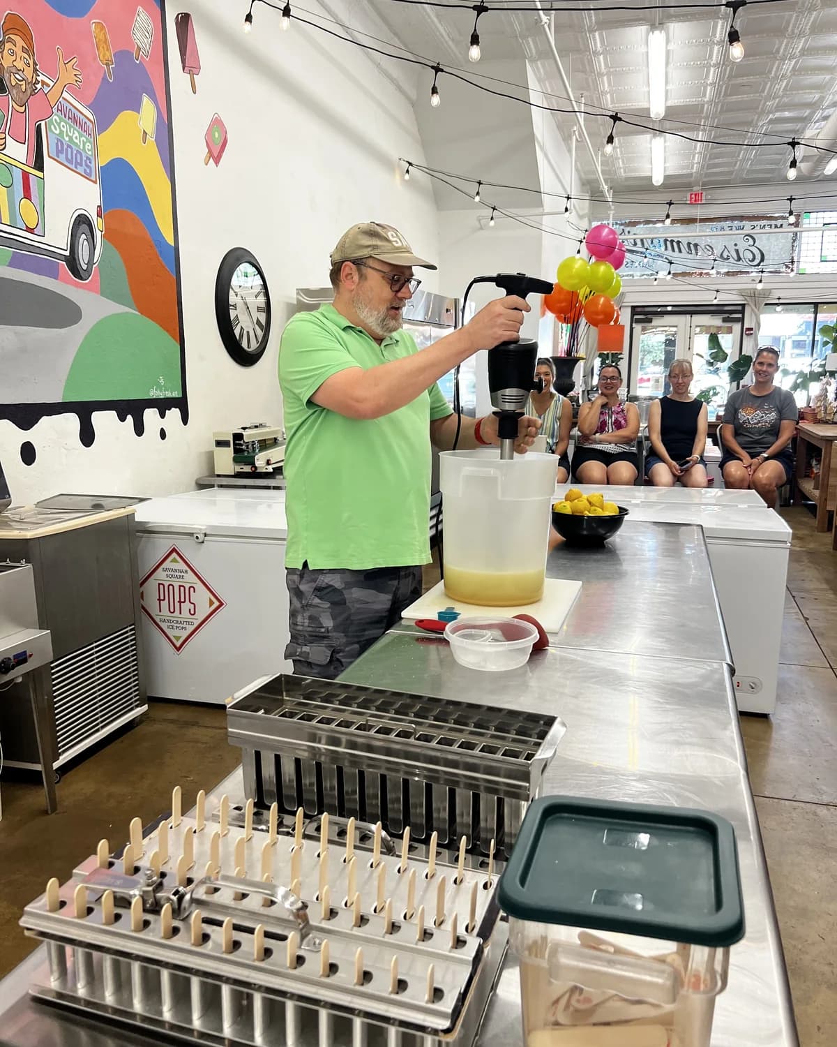 Judd leading a pop-making demonstration inside the Savannah Square Pops shop